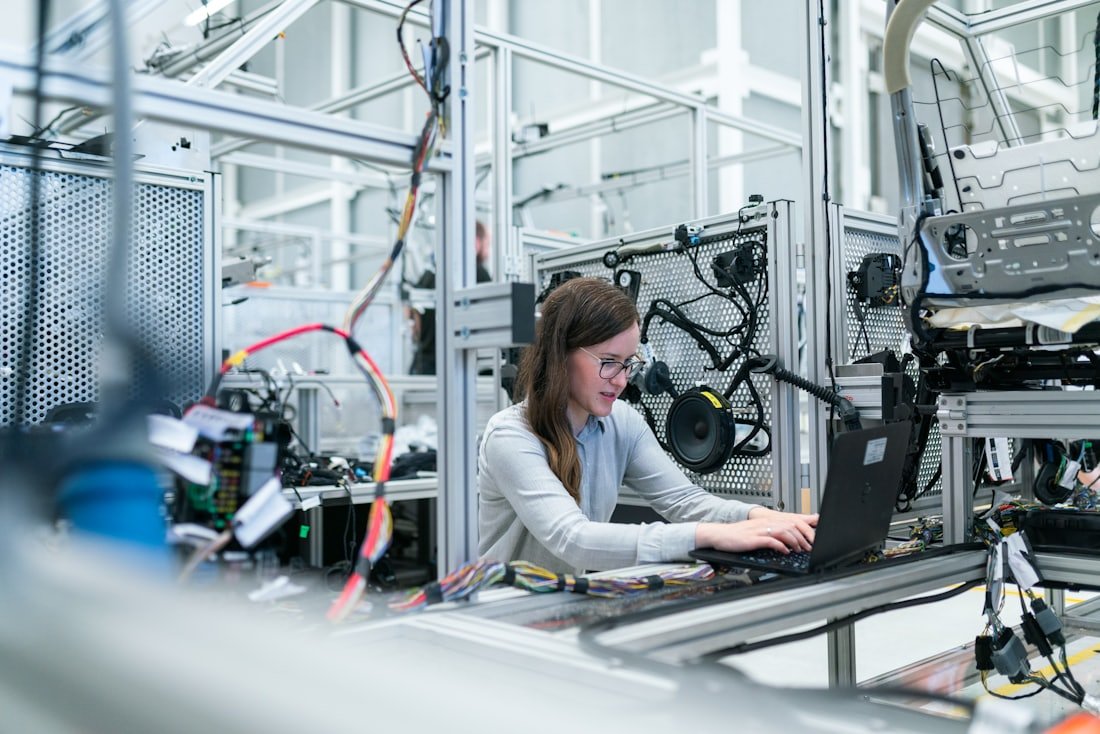 Diamtis team member working with precision manufacturing equipment